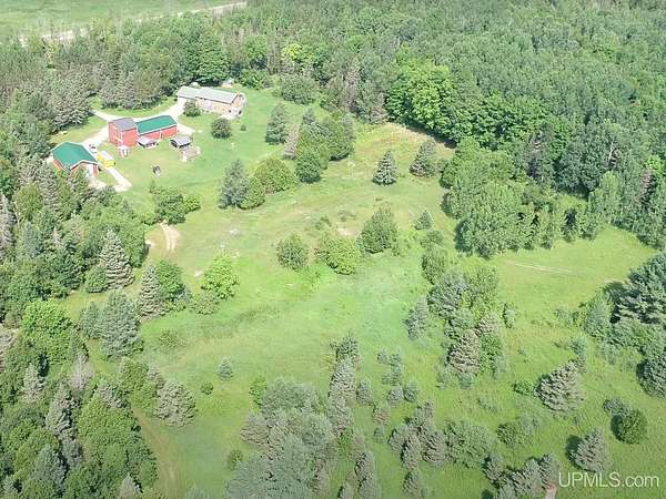 100 Acres of Land with Home for Sale in Chatham, Michigan