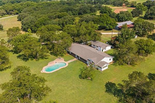 11 Acres of Land with Home for Sale in Grandview, Texas