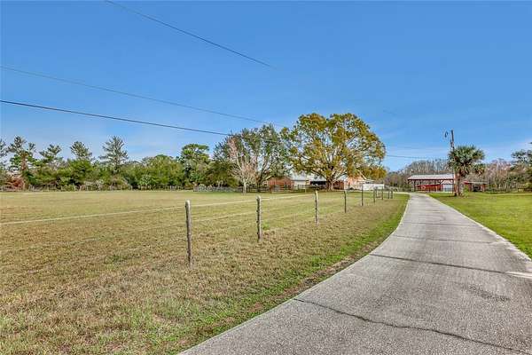 7 Acres of Land with Home for Sale in Mims, Florida