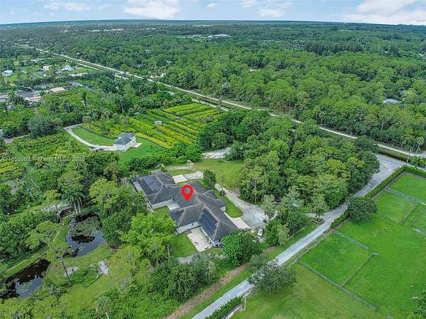 5 Acres of Residential Land with Home for Sale in Loxahatchee Groves, Florida