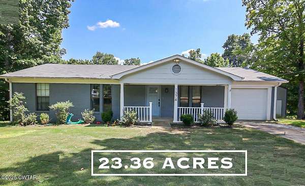 23.4 Acres of Land with Home for Sale in Jackson, Tennessee