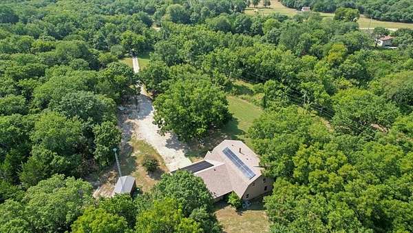 3.9 Acres of Residential Land with Home for Sale in Tom Bean, Texas