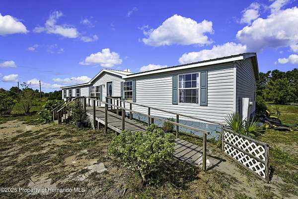2.5 Acres of Land with Home for Sale in Weeki Wachee, Florida