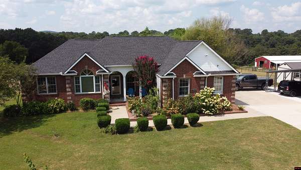 5.25 Acres of Land with Home for Sale in Flippin, Arkansas