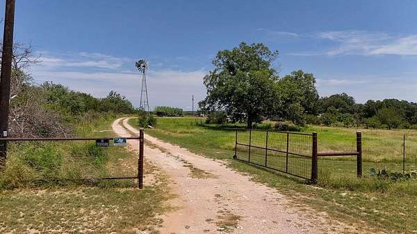 10 Acres of Residential Land with Home for Sale in Hext, Texas