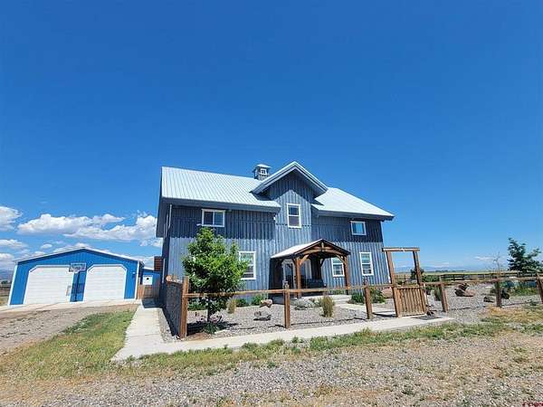 4.24 Acres of Land with Home for Sale in Del Norte, Colorado