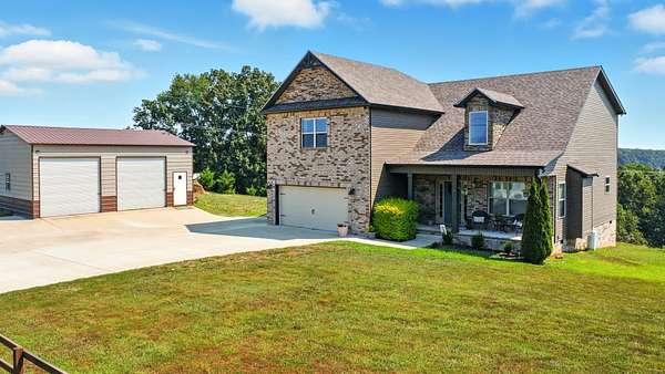 5.86 Acres of Residential Land with Home for Sale in Southside, Tennessee