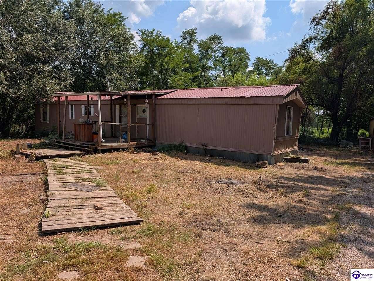 13.9 Acres of Land with Home for Sale in Garfield, Kentucky