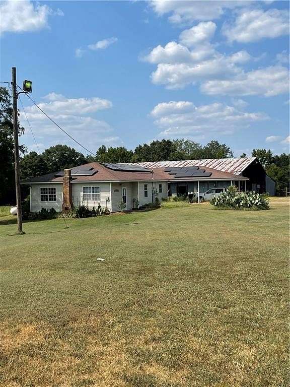 9.36 Acres of Land with Home for Sale in Ola, Arkansas