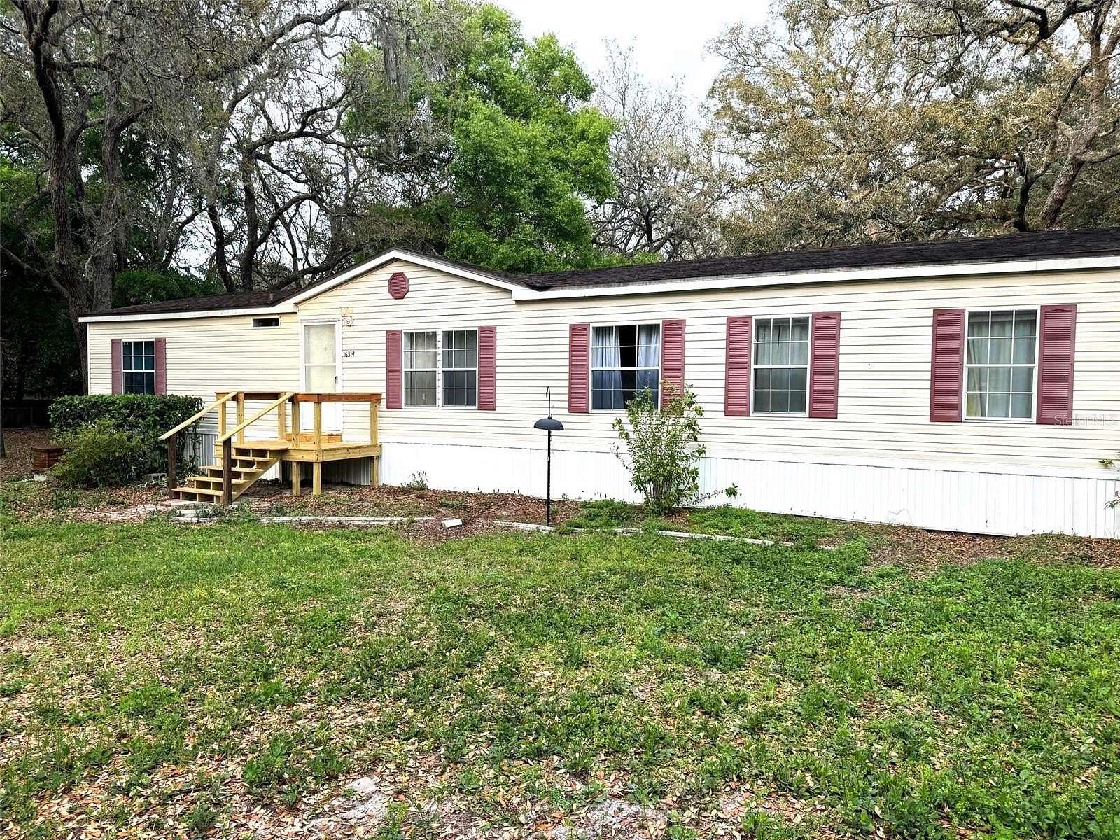 3.87 Acres of Residential Land with Home for Sale in Spring Hill, Florida