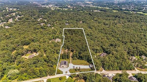 7.2 Acres of Land with Home for Auction in Fayetteville, Arkansas