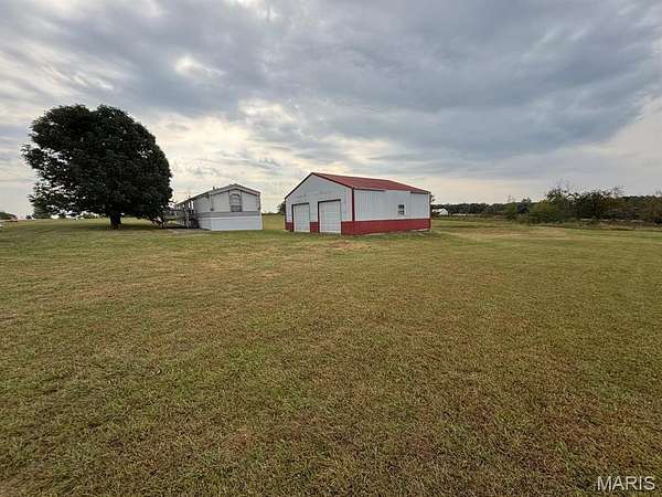 3 Acres of Residential Land with Home for Sale in New London, Missouri