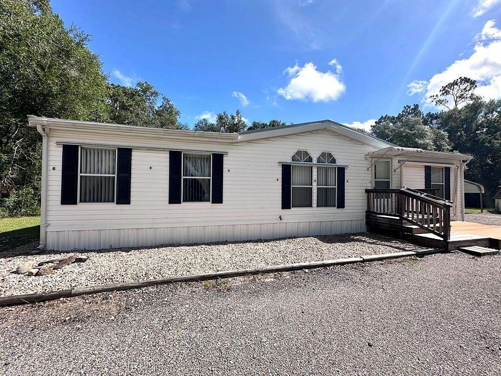 5 Acres of Residential Land with Home for Sale in Chiefland, Florida