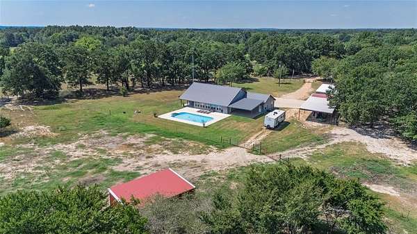 21.2 Acres of Agricultural Land with Home for Sale in Dike, Texas