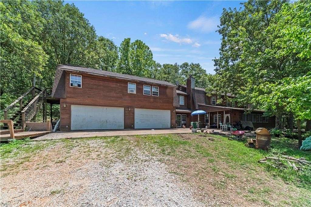 7 Acres of Residential Land with Home for Sale in Elkins, Arkansas