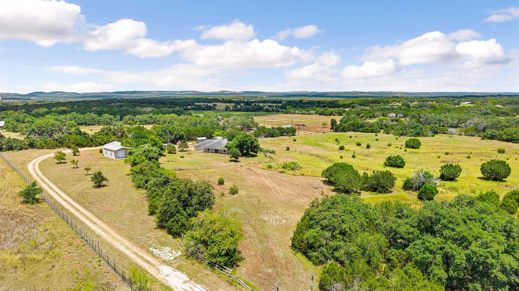 10.9 Acres of Land with Home for Sale in Blanco, Texas