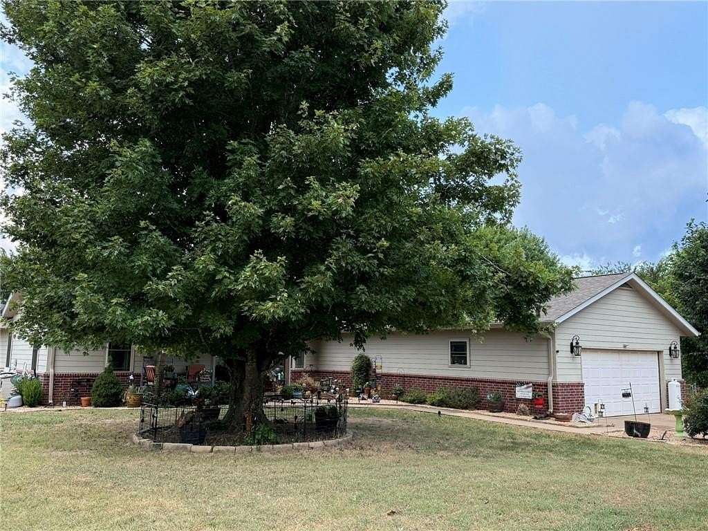 52 Acres of Agricultural Land with Home for Sale in Gravette, Arkansas