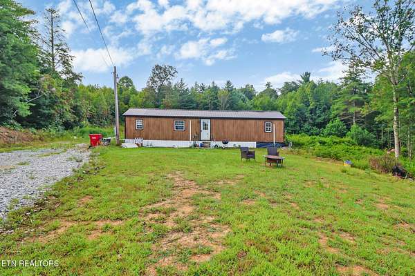 5.76 Acres of Residential Land with Home for Sale in Deer Lodge, Tennessee