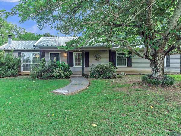 11.2 Acres of Land with Home for Sale in Hughes Springs, Texas