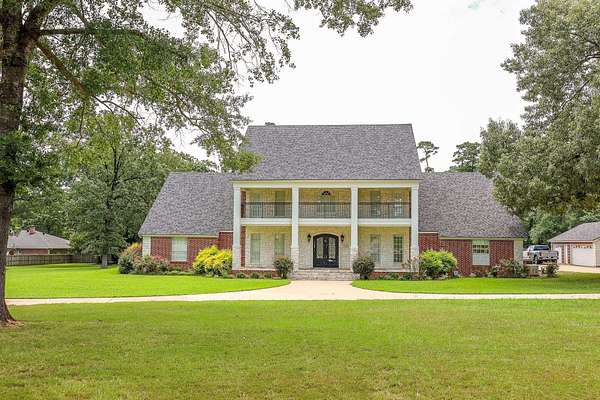 3.28 Acres of Land with Home for Sale in Carthage, Texas