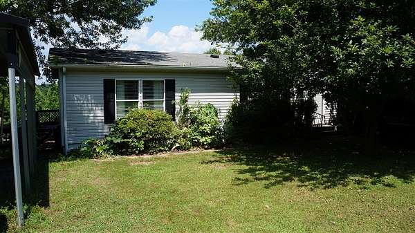 0.32 Acres of Residential Land with Home for Sale in Austin, Kentucky