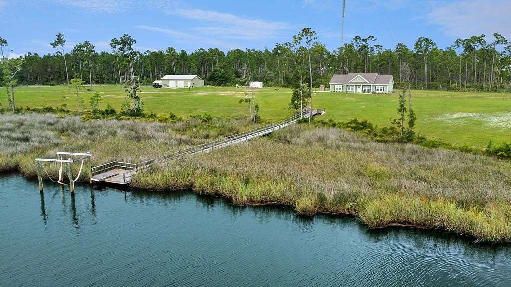 6.19 Acres of Residential Land with Home for Sale in Wewahitchka, Florida