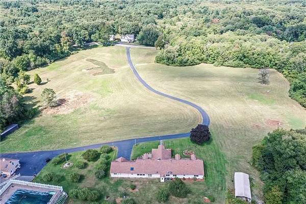24.3 Acres of Land with Home for Sale in Attleboro, Massachusetts