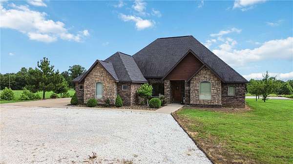 3 Acres of Land with Home for Sale in Gravette, Arkansas