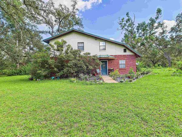 5.73 Acres of Land with Home for Sale in Mayo, Florida