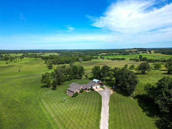 14.3 Acres of Land with Home for Sale in Vanzant, Missouri
