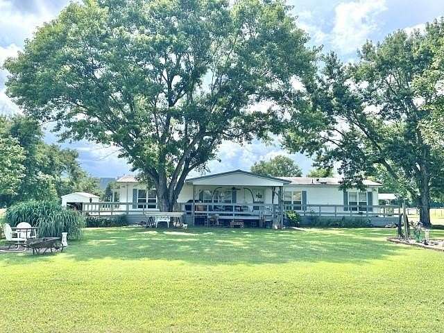 5.63 Acres of Land with Home for Sale in Flippin, Arkansas
