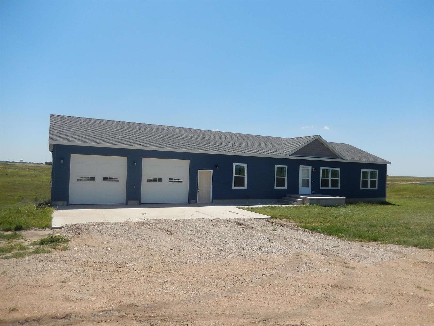 5.1 Acres of Land with Home for Sale in Russell, Kansas