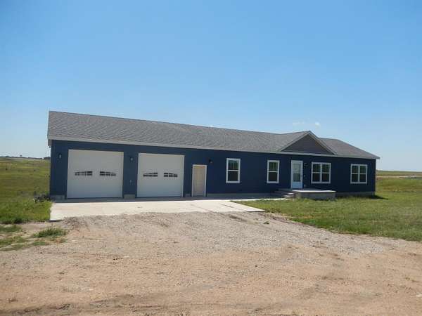 5.1 Acres of Residential Land with Home for Sale in Russell, Kansas