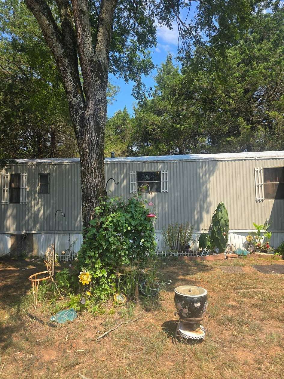 15 Acres of Land with Home for Sale in Paris, Arkansas