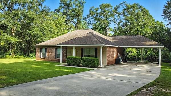 1.55 Acres of Land with Home for Sale in Carriere, Mississippi