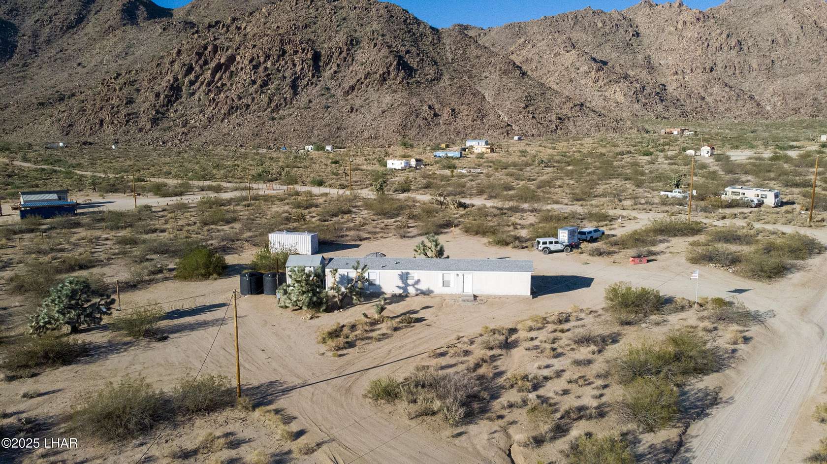 2 Acres of Residential Land with Home for Sale in Yucca, Arizona