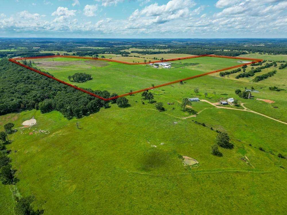 200 Acres of Agricultural Land with Home for Sale in Lebanon, Missouri
