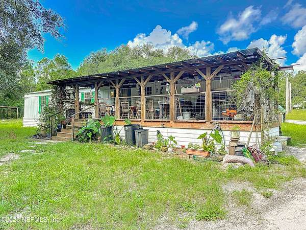 5.3 Acres of Residential Land with Home for Sale in Keystone Heights, Florida