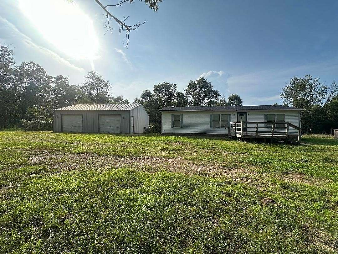 7.2 Acres of Residential Land with Home for Sale in Vanzant, Missouri