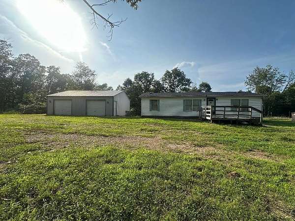 7.2 Acres of Residential Land with Home for Sale in Vanzant, Missouri