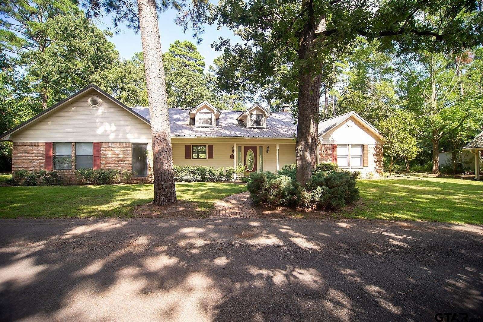 1.58 Acres of Residential Land with Home for Sale in Holly Lake Ranch, Texas