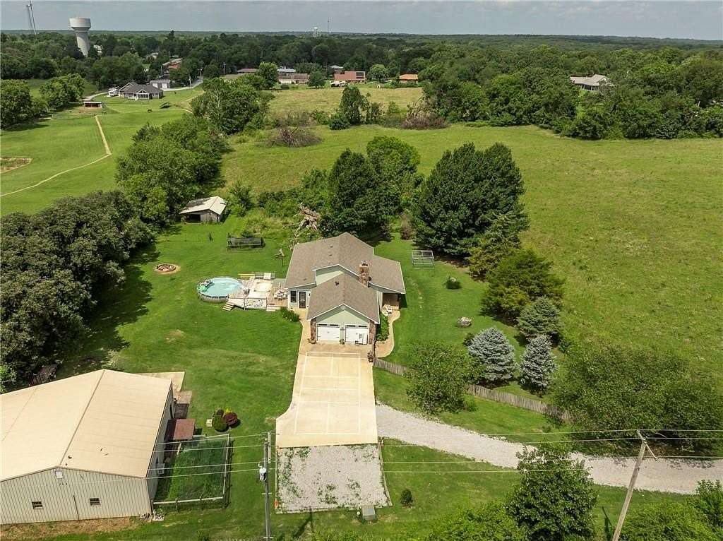 8.4 Acres of Residential Land with Home for Sale in Gravette, Arkansas