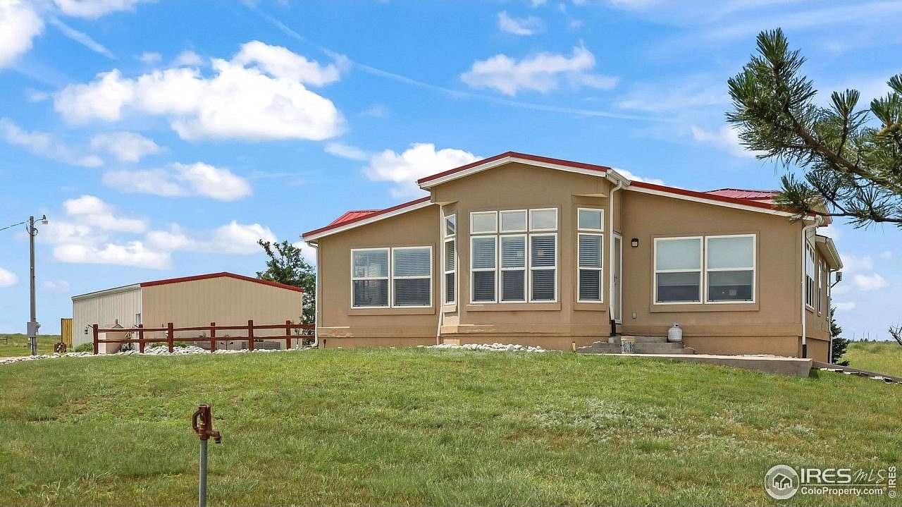 80 Acres of Agricultural Land with Home for Sale in Akron, Colorado