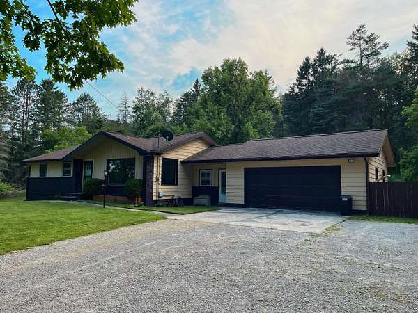 4 Acres of Residential Land with Home for Sale in Hubbard Lake, Michigan