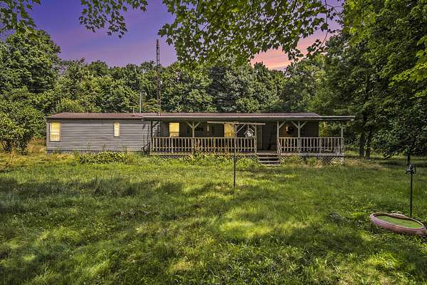 9.75 Acres of Residential Land with Home for Sale in Eau Claire, Michigan