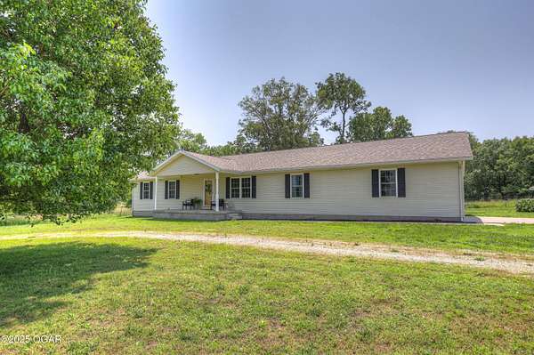 10 Acres of Land with Home for Sale in Carthage, Missouri