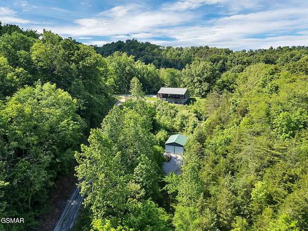 25.4 Acres of Land with Home for Sale in Bybee, Tennessee