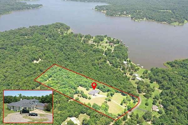 10 Acres of Residential Land with Home for Sale in Scroggins, Texas