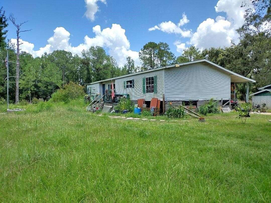 10 Acres of Land with Home for Sale in Bunnell, Florida