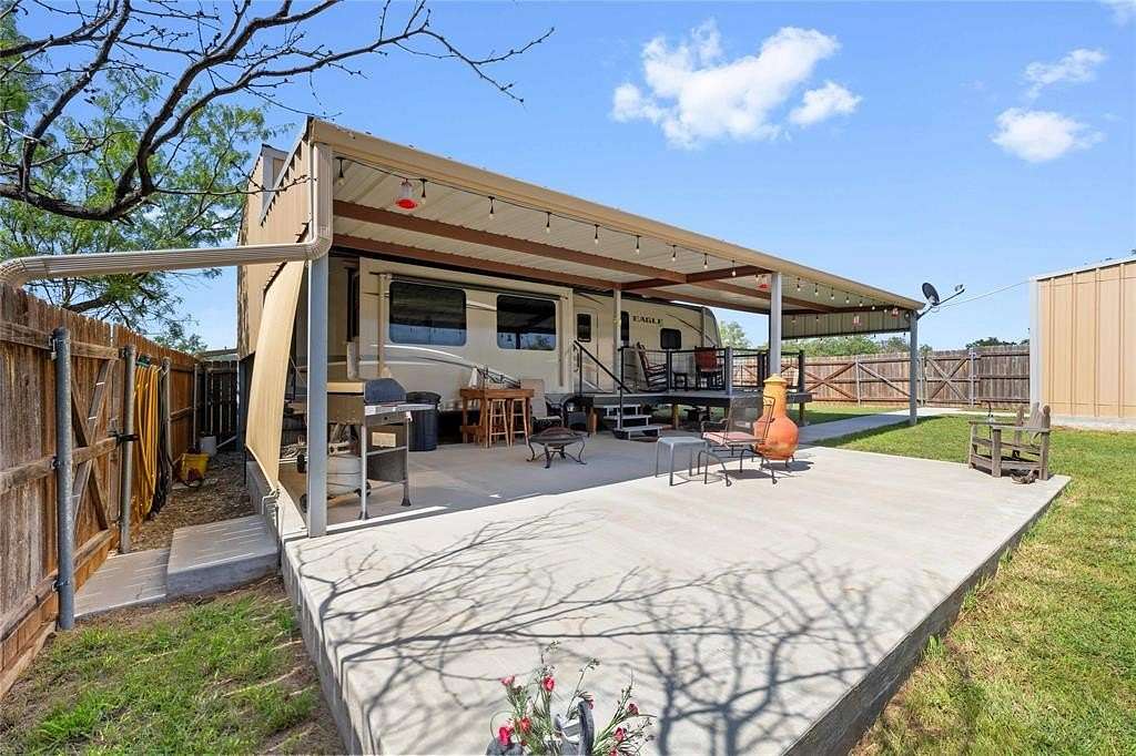 0.69 Acres of Residential Land with Home for Sale in May, Texas